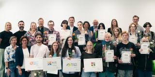 Abgebildet sind Impressionen zur Preisverleihung im internationalen Logowettbewerb „Berufe rund ums Rad“.